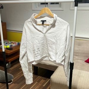 white cropped quarter zip with nyc graphic